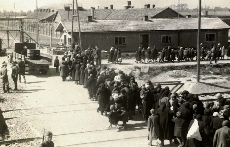 Birkenau a group of jews walking towards the gas chambers and crematoria